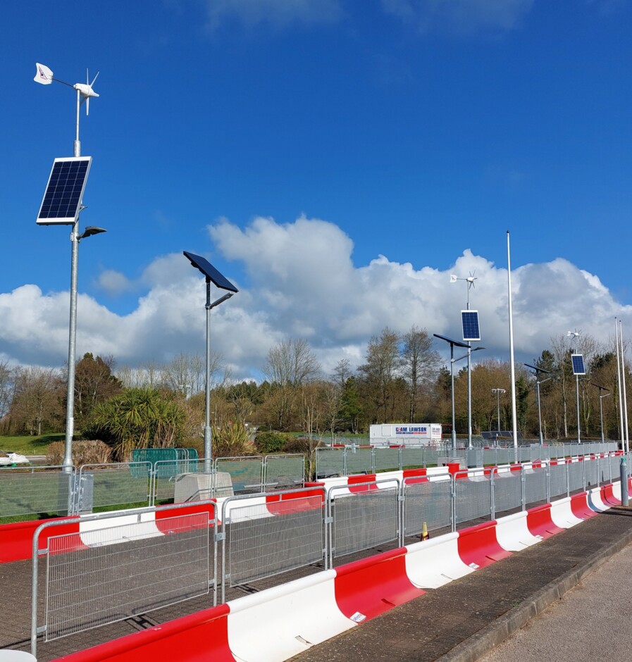 Image of lighting systems in a car park powered by wind and solar
